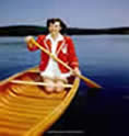 A woman canoeing on Minaki Lake